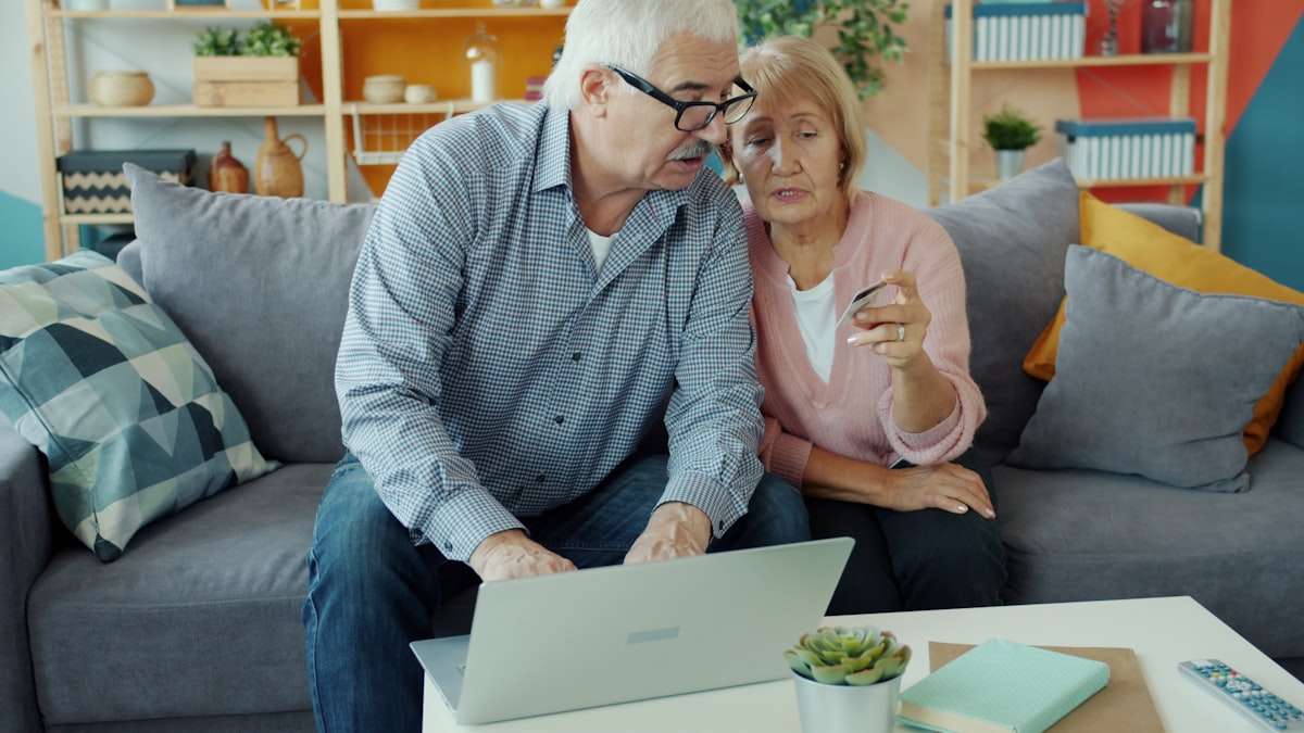 A retired couple reviewing their retirement plan together at home